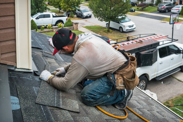 Professional Roofing technician working in West Branch, IA